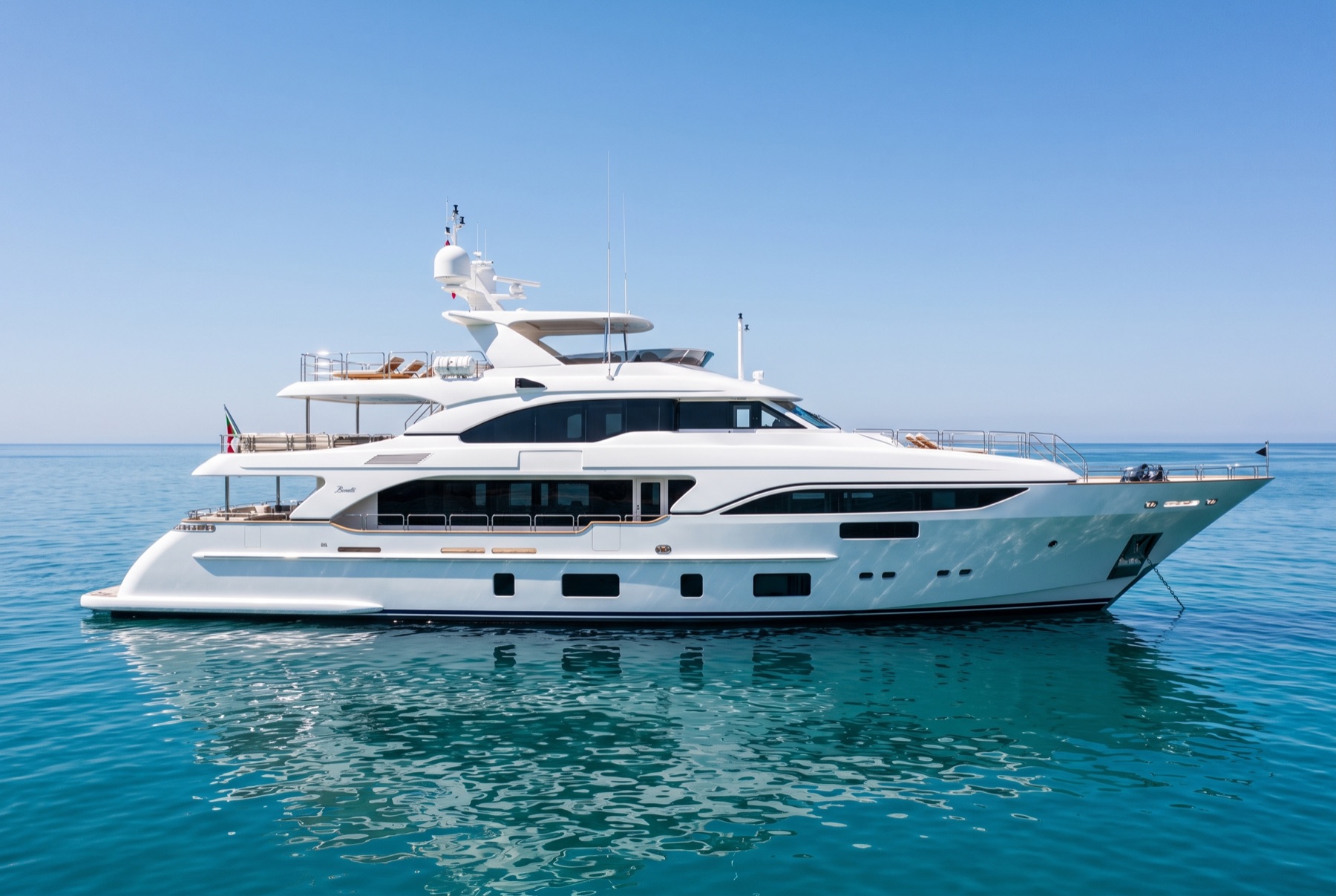 A motor yacht on calm turquoise water